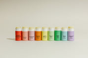 Good Flower Farm’s Rainbow Organic Lip Balm Set of 9 features all flavors, each with a pastel-colored label—blood orange grapefruit, peach, raspberry, orange cream, lemon vanilla, sweet mint, basil mint, and lavender mint.